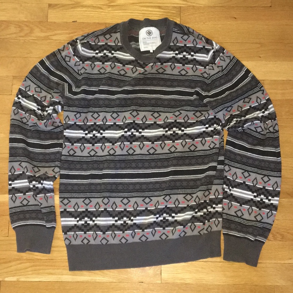 Gray patterned sweater.